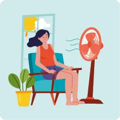 Femme assise avec un ventilateur