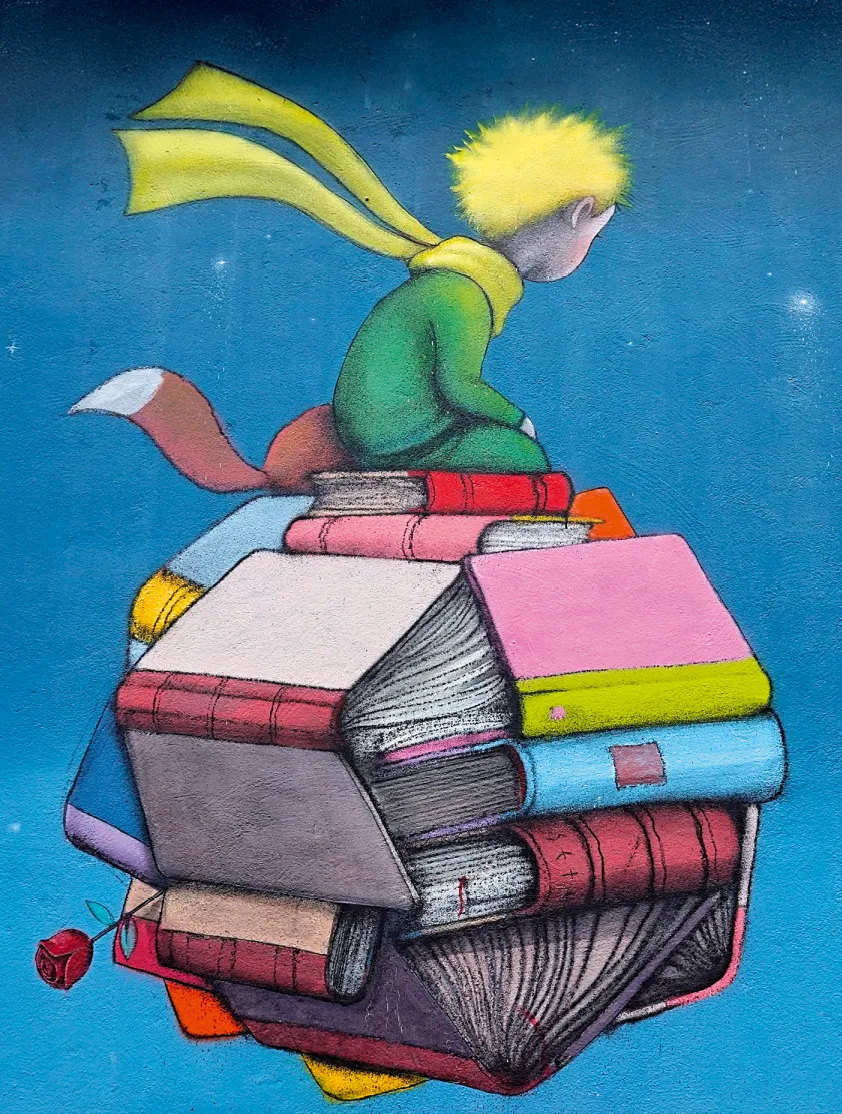 Seth Globepainter, fresque murale représentant le Petit Prince assis sur un empilement de livres, avec un renard et une rose, Paris 17e.