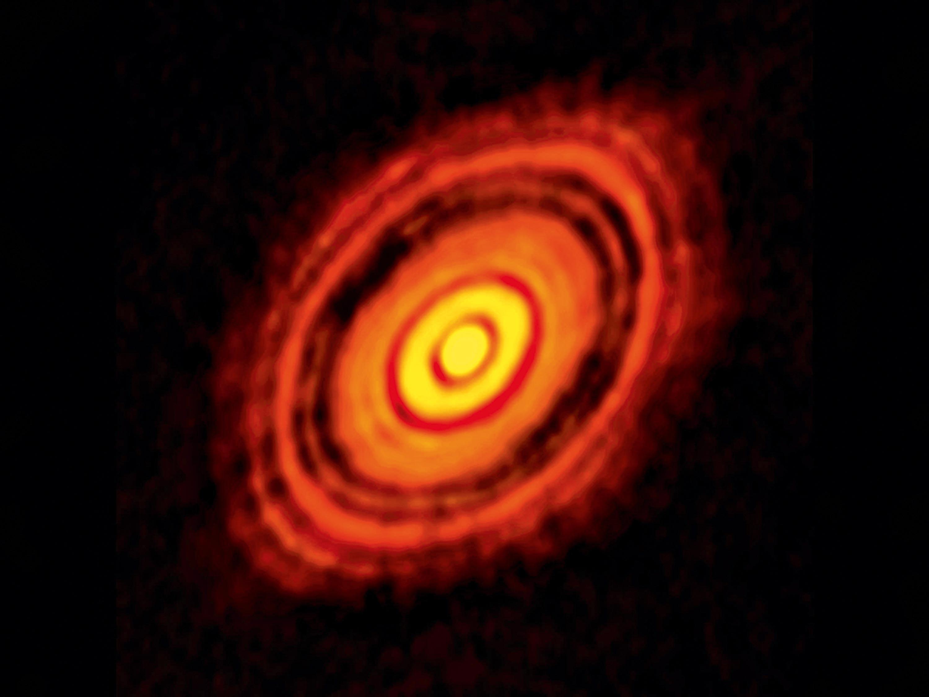 <stamp theme=pc-green1>Doc. 3</stamp> Une étoile et ses planètes en cours de formation (radiotélescope ALMA, Chili).