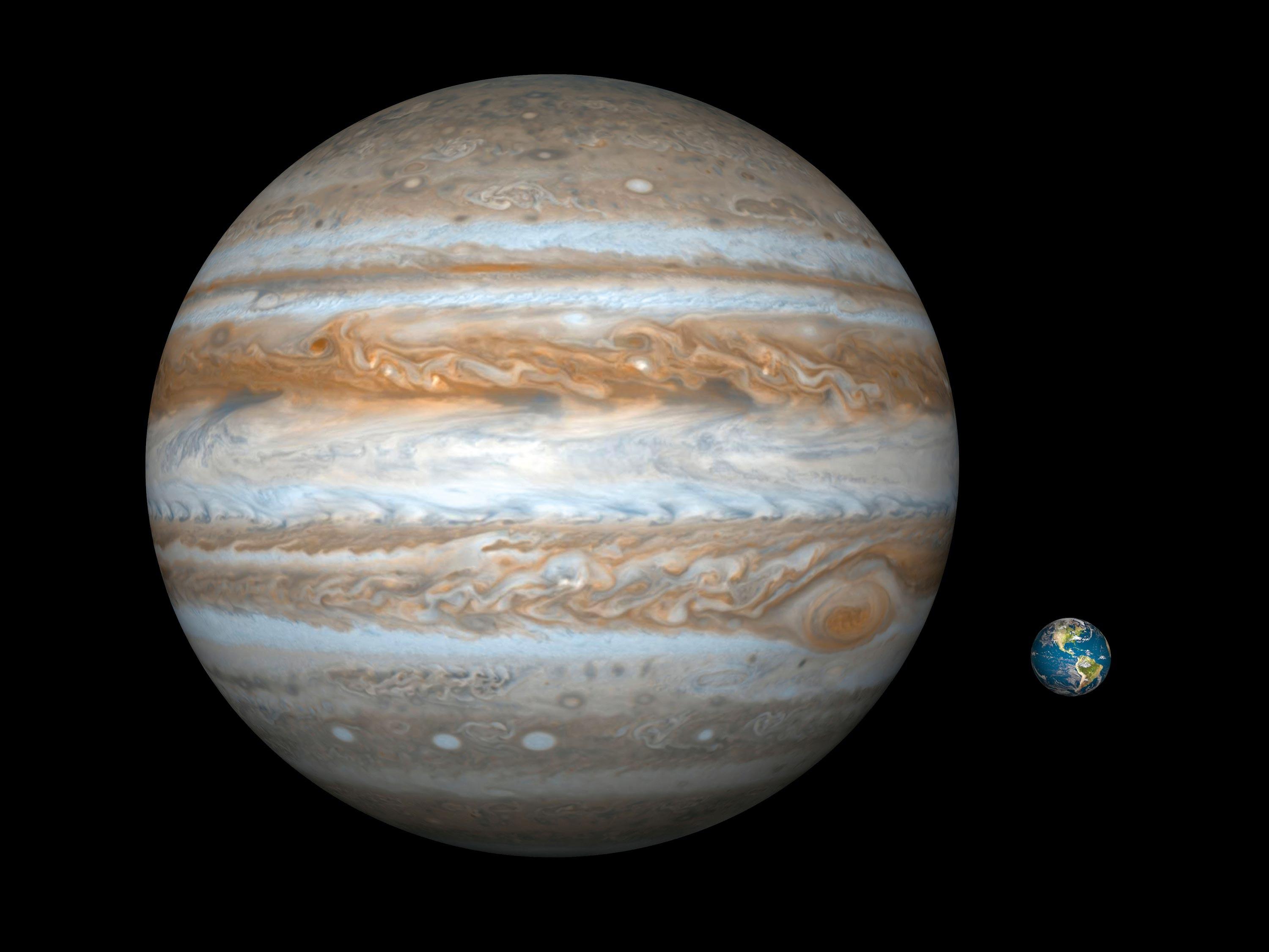 <stamp theme='svt-green1'>Doc. 1</stamp> Une illustration comparative de Jupiter (à gauche) et de la Terre (à droite).