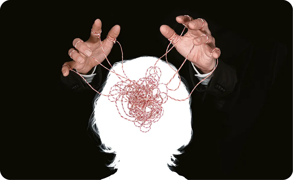 Obeying master hand pulling the strings in the silhouette of a human head.