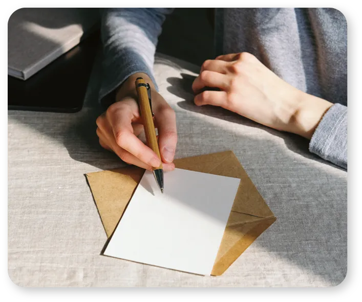 Person writing a letter.