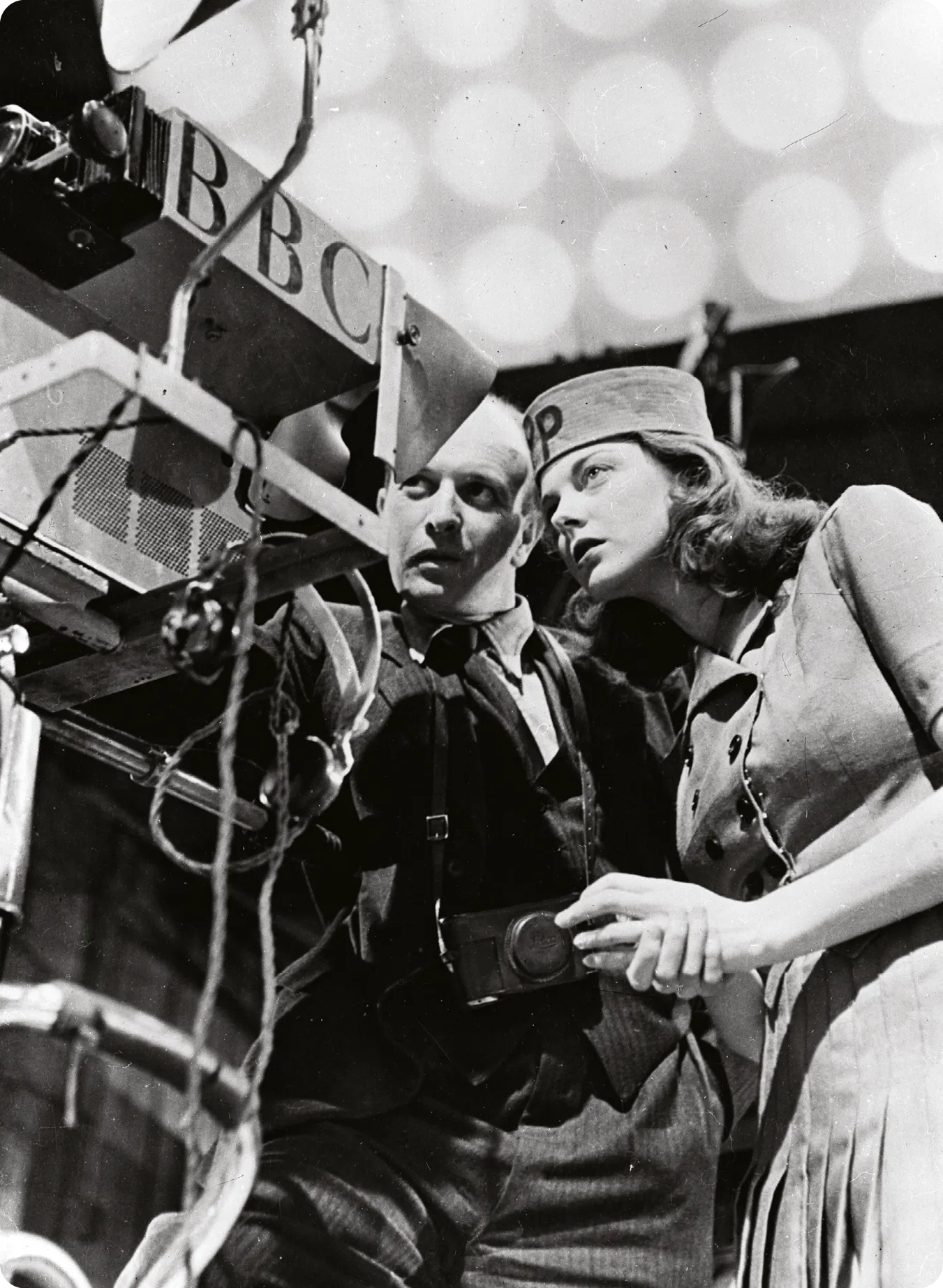 24-year-old Paddy Bath, new hostess of the television show Picture Page learns the workings of a TV camera from BBC cameraman O Eddy at Alexandra Palace, London.