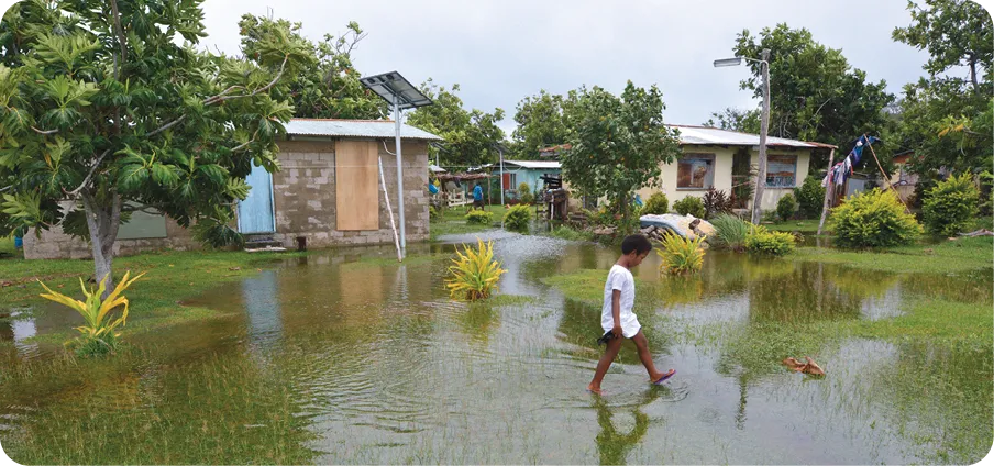 Indigenous Fijian girl (Miriam Bulivono age 8) in flooded land in Fiji. On Feb 2016 Severe Tropical Cyclone Winston was the strongest tropical cyclone in Fiji in recorded history.