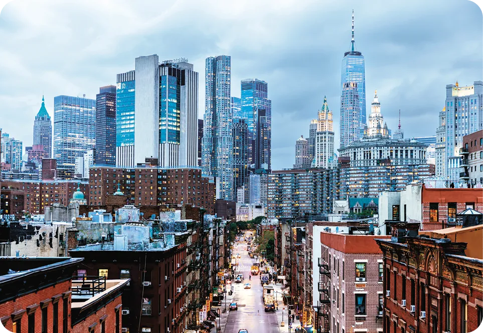 Illuminated Manhattan Financial District skyscrapers seen from Chinatown, New York City, USA