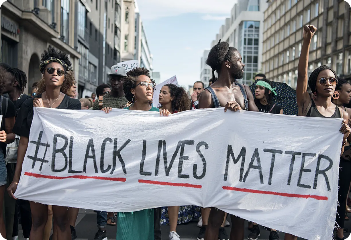 Demonstrators held a banner with the twitter
hashtag Black Lives Matter, Berlin, 2016.