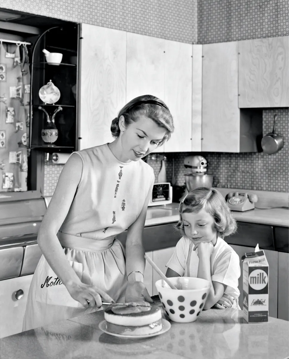 Mother and daughter making a cake, 1956