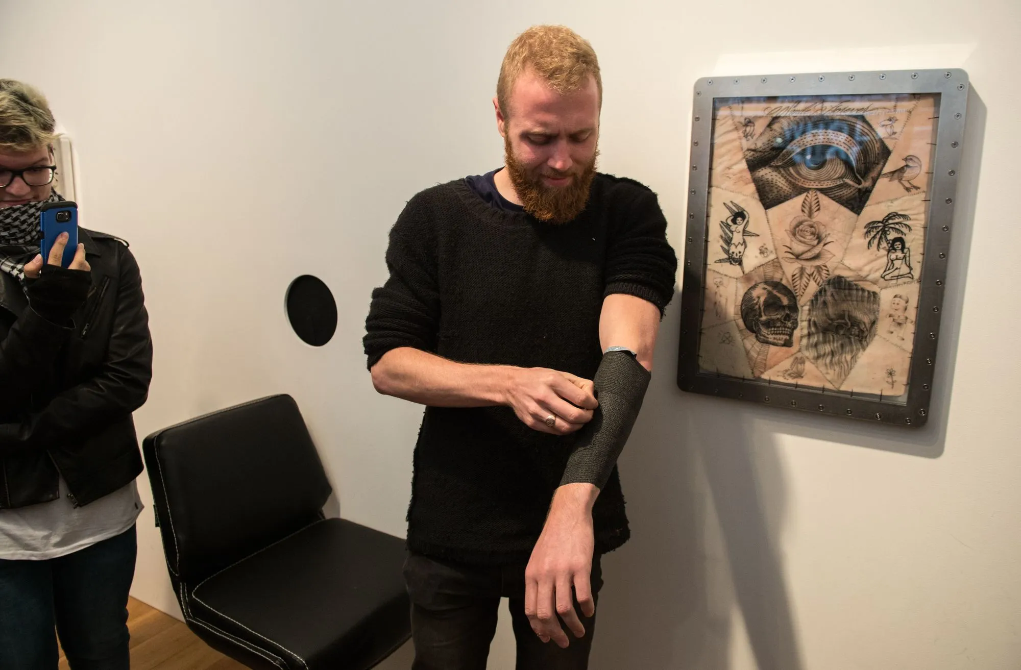 A lucky customer at the “Whole Glory” pop-up tattoo parlor, 2016.