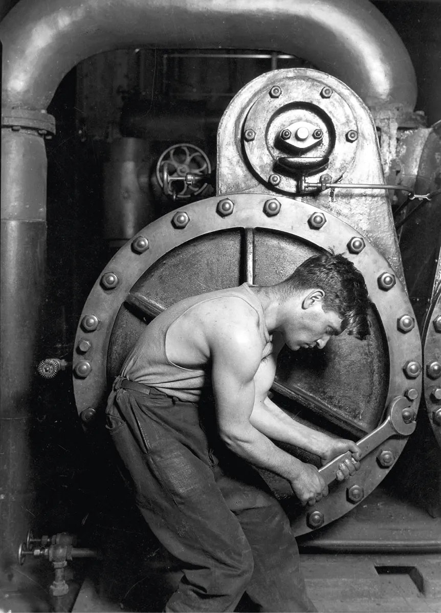 Mécanicien travaillant sur une machine à vapeur