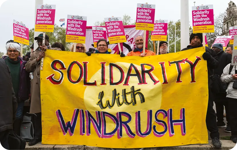 Demonstrators march through central London in solidarity with the Windrush generation 2018.