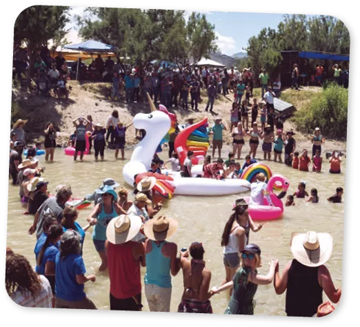 Art festival with crowd gathering around colorful installations.
