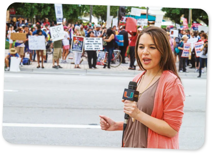 A journalist reporting live from a protest.