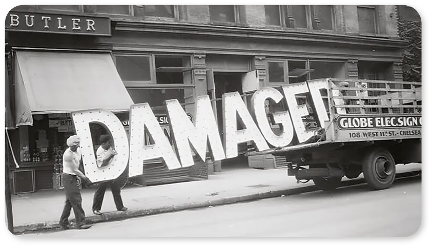 “Damaged” sign, New York, Walker Evans, 1928.
