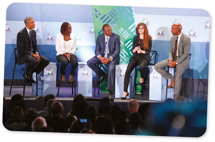 Panel discussion with multiple speakers on stage.