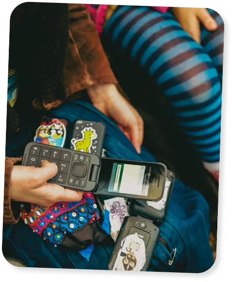 Person with multiple flip phones.