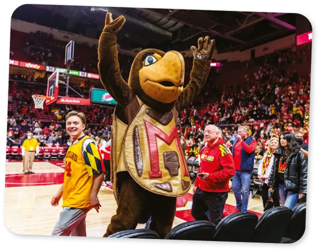 College Park, Maryland, USA. 26th Feb, 2023. Testudo, the University of Maryland mascot, celebrates with fans after defeating #21 Northwestern Univers