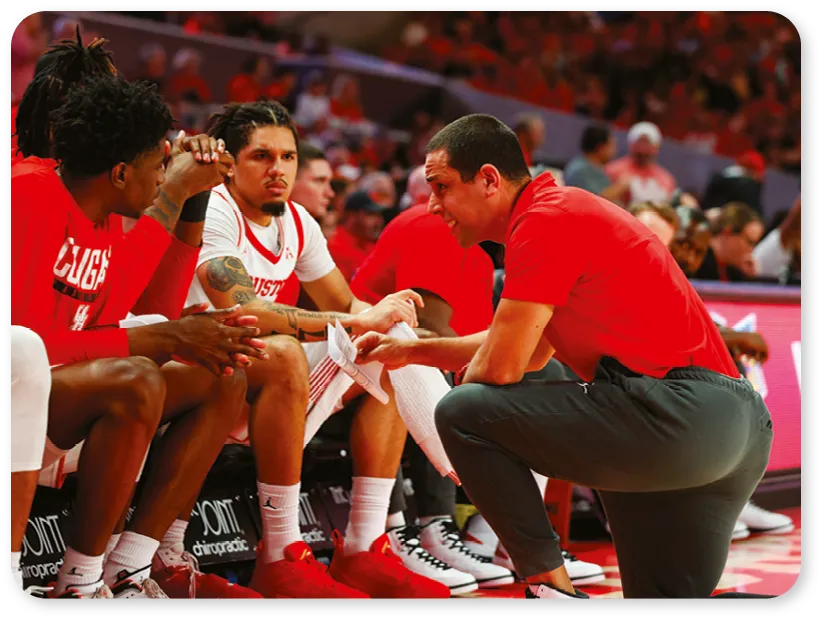 Houston, TX, USA. 2nd Mar, 2023. Houston Cougars assistant coach Kellen Sampson (right) talks with players during an NCAA college basketball game between Houston and Wichita State on Mar. 2, 2023, in Houston.