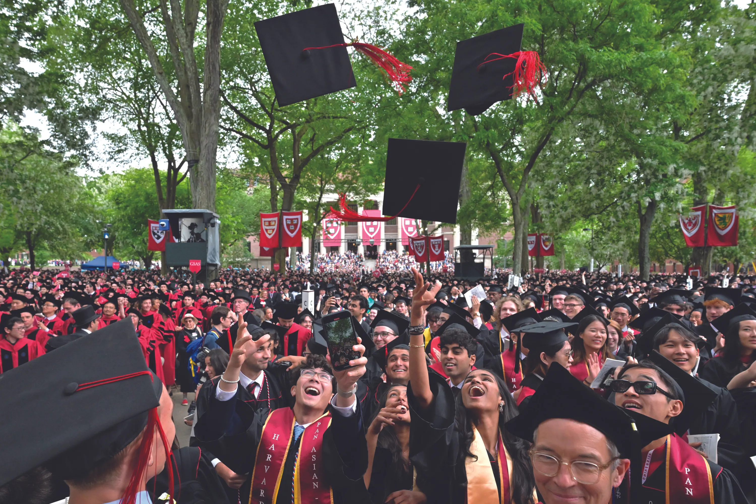 Students celebrate receiving their degrees at Harvard University's 374th graduation ceremony, May 2025.